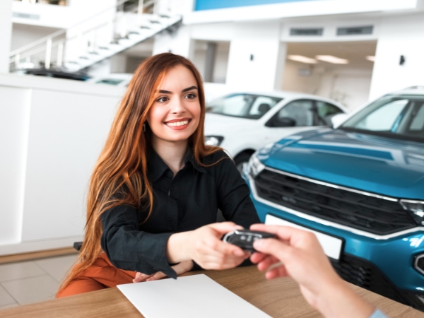 Woman Receiving a Car Key