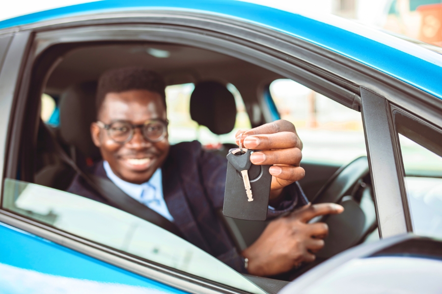 Man Driving a Blue Car